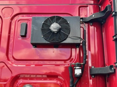 Freightliner Cascadia 126 engine bay showing radiator cooling fan and components