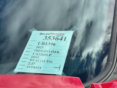 Paper tag on windshield showing stock number 353641, VIN partial, model CA126SLP, Freightliner DD15, DT-12 (AUTO), 2.47 fuel? 1VERITT, SelectTrucks Atlanta.