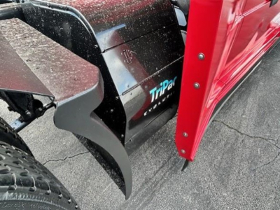 Truck front left mudguard and snow plow attachment showing TripDir EVOLUTION logo on side panel.