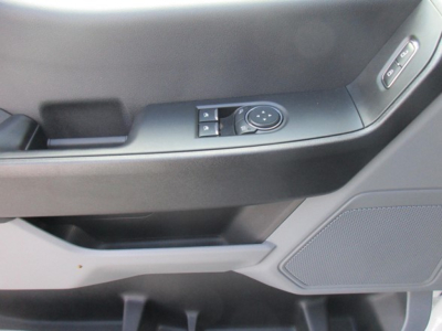 Ford F-550 interior door panel with window/mirror control buttons visible