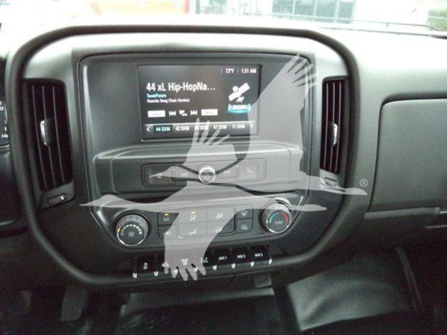 Dashboard of a 2023 International CV showing the center touchscreen, climate controls, and radio display.