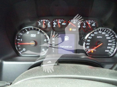 Dashboard of a 2023 International CV showing tachometer, speedometer, fuel gauge, and a central display with 'Fuel Level Low' warning.