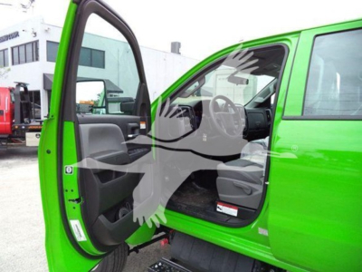 Green 2023 International CV rollback truck interior view with front door open showing driver seat and dashboard.