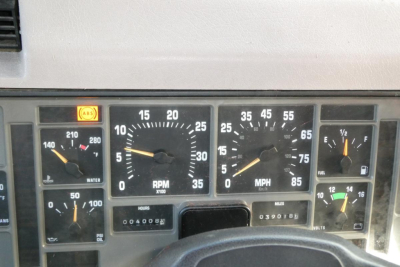 Dashboard of an International truck showing gauges: RPM x1000 dial, speed MPH dial, fuel gauge, water temperature, oil pressure, volt gauge, and hour meter reading 0400? miles 03908? with ABS light.