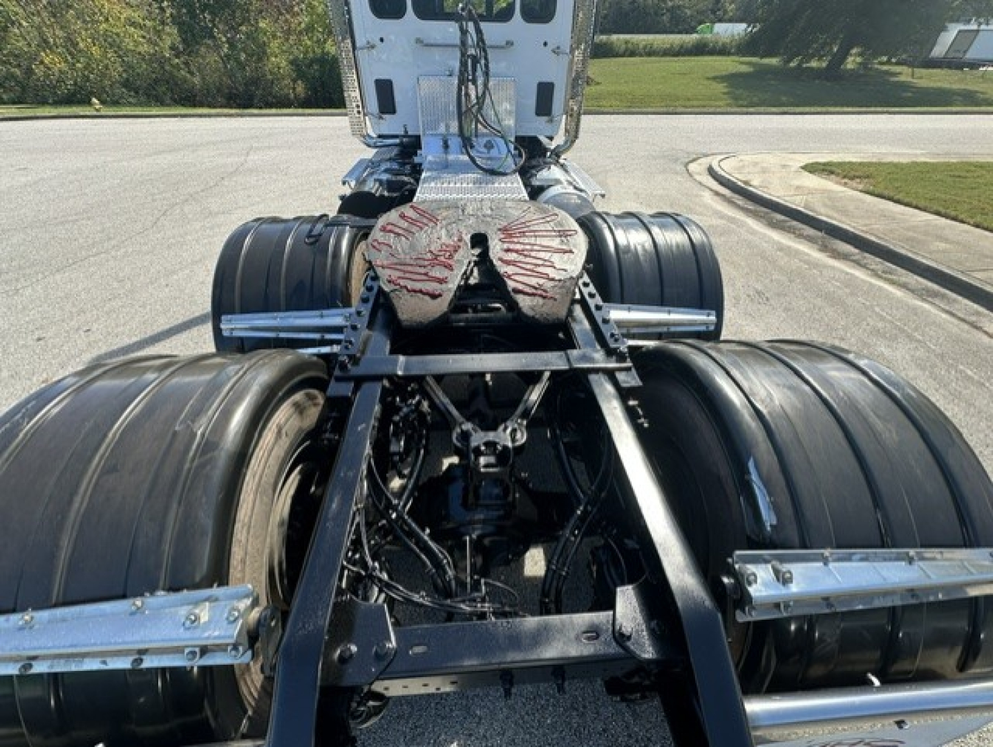Kenworth T880 fifth wheel area showing rear dual axle undercarriage and drive components