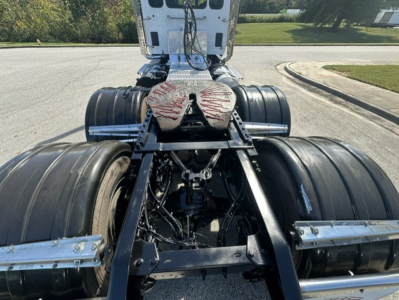 Kenworth T880 fifth wheel area showing rear dual axle undercarriage and drive components