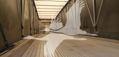 Trailer interior showing aluminum floor and side rails with a large white bird logo overlay.