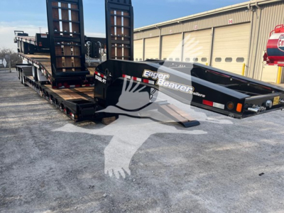 Eager Beaver 50Gsl-Pt lowboy trailer in loading position showing gooseneck and ramps with Eager Beaver branding.