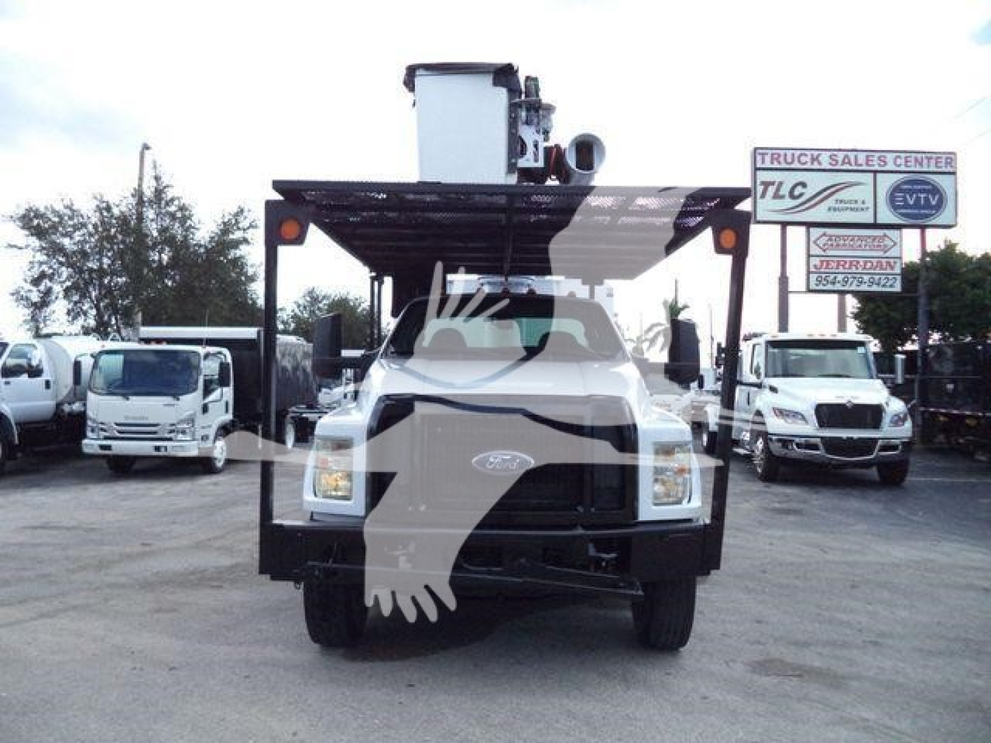 Ford F750 bucket truck front view showing utility body and crane equipment mounted on chassis.