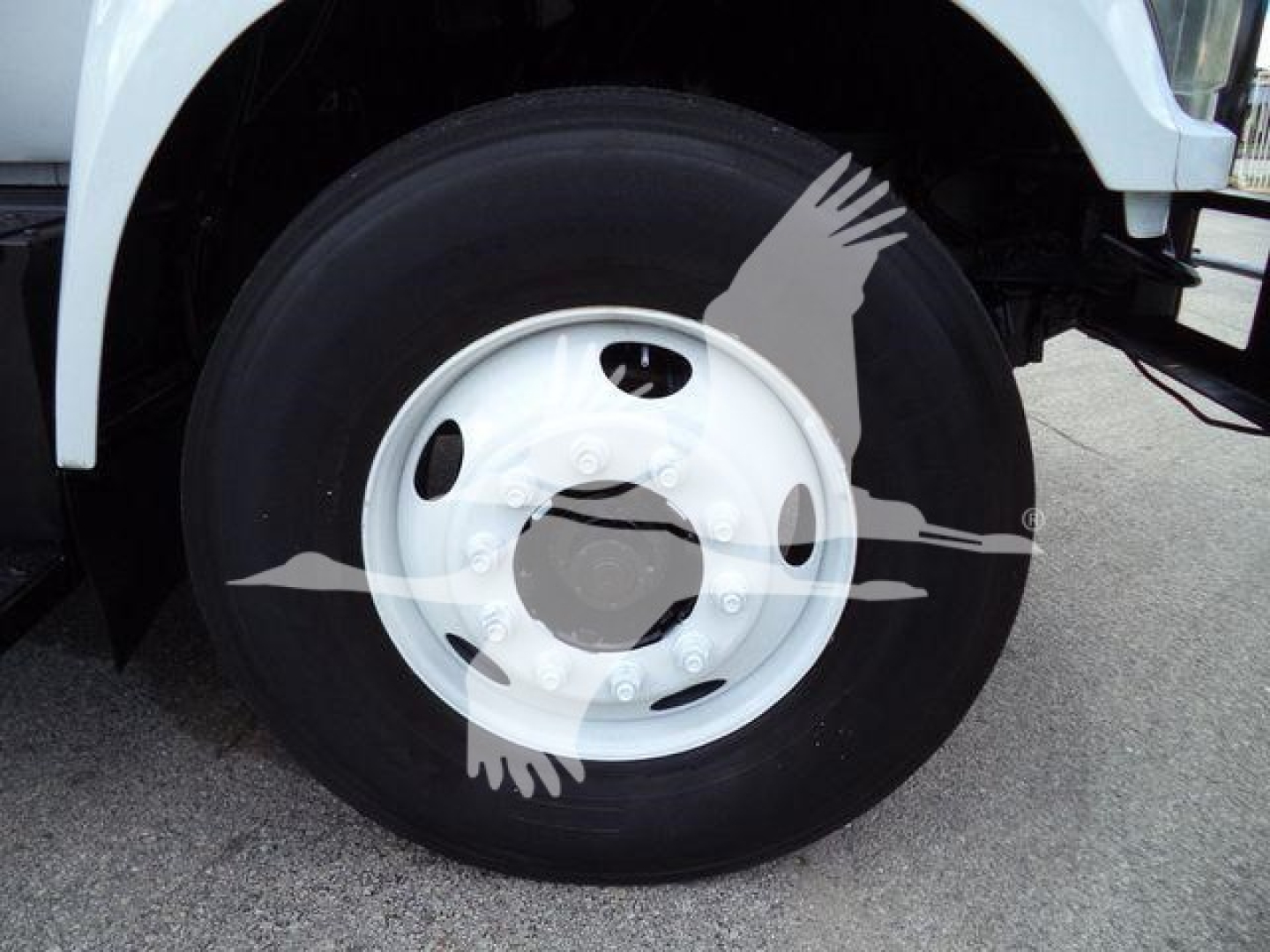 Wheel and tire close-up on a 2017 Ford F750 bucket truck showing steel wheel and black tire.