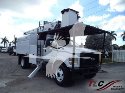 Ford F-750 bucket truck in service showing bucket lift and utility body along with fuel cap and ladder components.
