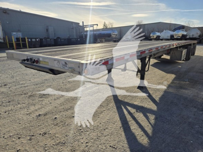 Flatbed trailer showing Maxmiser platform with reflective tape, triangular end caps, and side rails. Visible text includes stock number 7444 on front left corner and a plate area.
