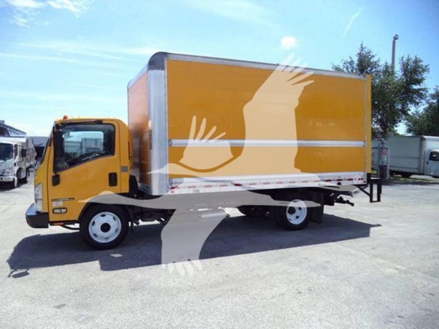 Isuzu NPR HD box truck with yellow cargo box and white reflective stripe, side view.
