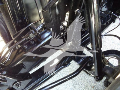 Isuzu NPR HD truck chassis components with suspension and hydraulic lines visible.