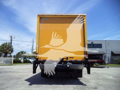 Isuzu NPRHD box truck rear view showing cargo area and bumper components.