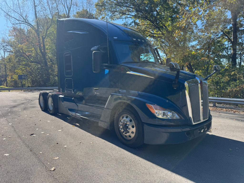 Kenworth T680 truck in service view showing front grille and side profile.