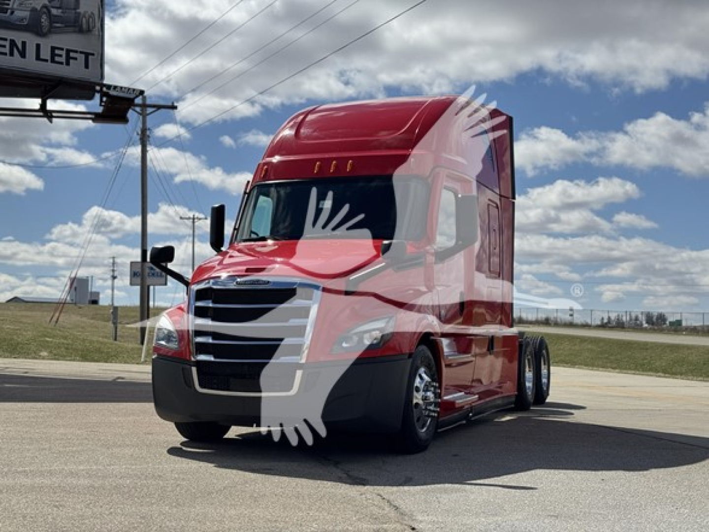 2023 Freightliner Cascadia 126 tractor in red, cab front view with shadowed wheels and clear sky.