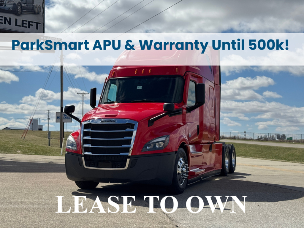 Freightliner Cascadia 126 tractor in red, lease to own banner, ParkSmart sign, front three-quarter view.