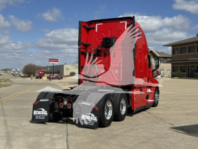 Truck rear view showing red Freightliner Cascadia 126 sleeper cab with dual rear axles and mud flaps, VIN plate area not visible.