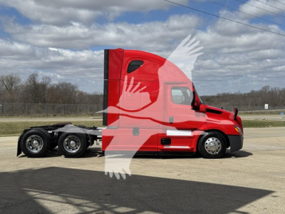 Red Freightliner Cascadia 126 tractor side view showing sleeper cab and 6-wheel rear axle on a paved lot.