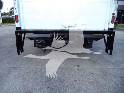 Isuzu NPR HD truck rear showing underbody components and bumper supports.