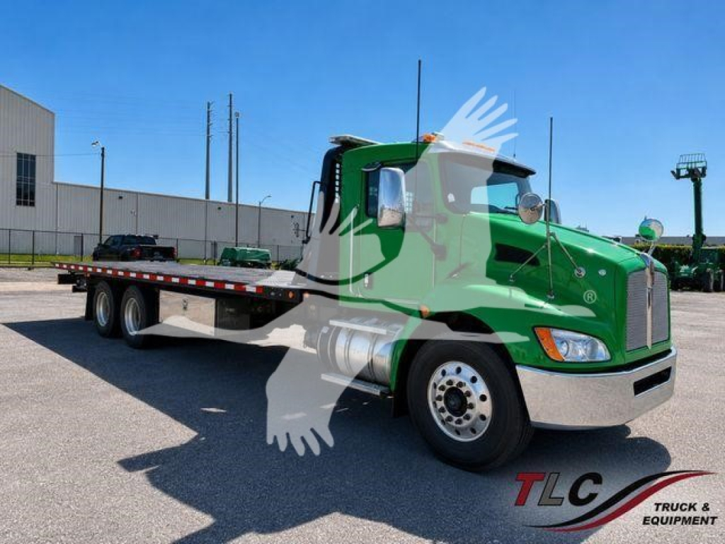 Truck: 2016 Kenworth T370 rollback tow truck in green with flatbed, front chrome bumper, side profile, VIN 3BKHLJ0X5GF118642 visible on listing.