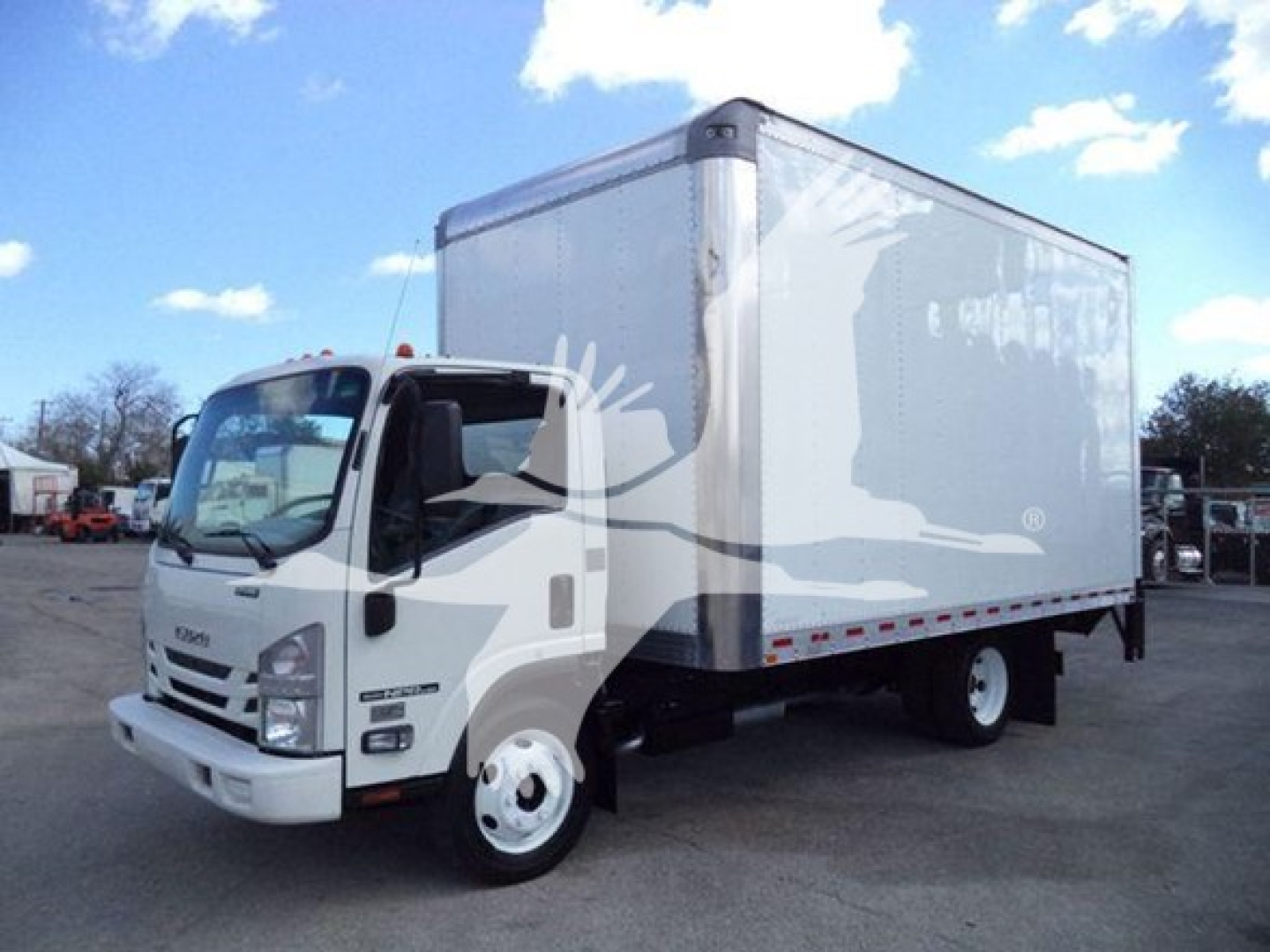 Isuzu NPR-HD box truck with cargo box, front cab and side view. Visible text includes Isuzu logo on grille and model badge.