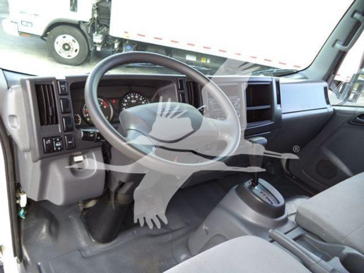 Isuzu NPR HD truck interior steering wheel dashboard and driver seat area
