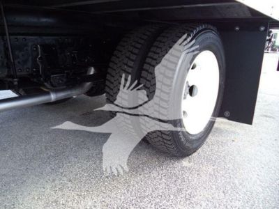 Isuzu NPR HD truck wheel and undercarriage view showing front tire and axle components.
