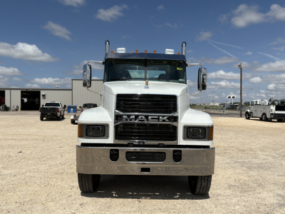 Mack PI64T conventional daycab truck front view showing Mack grille, large bumper, and headlights.