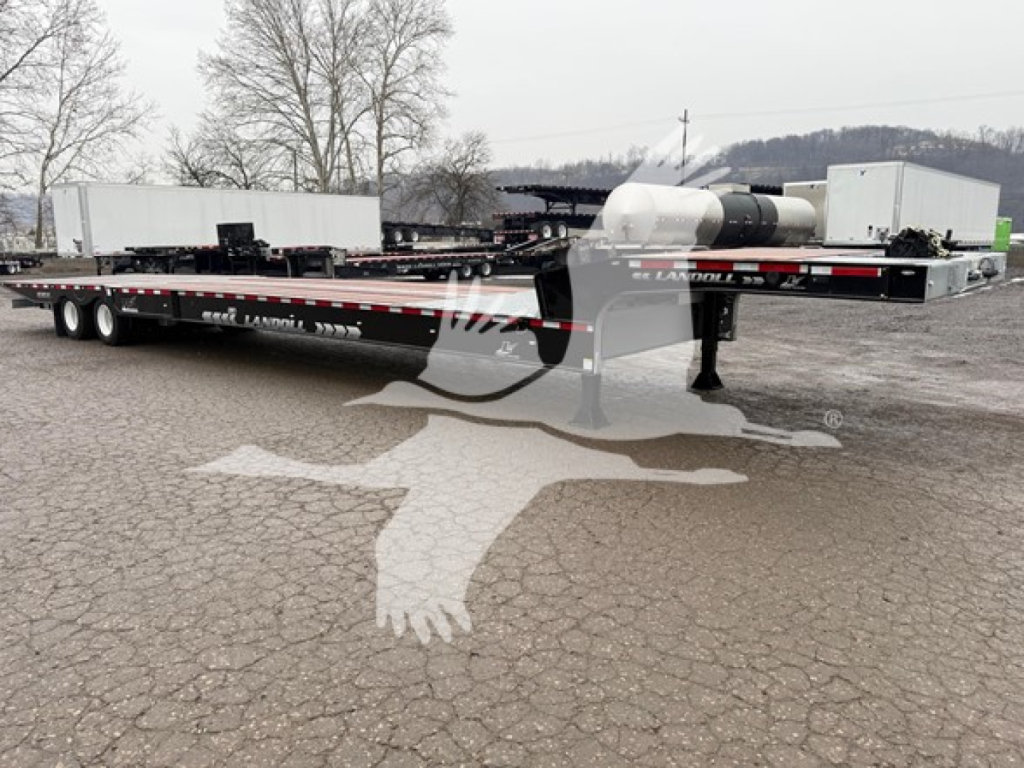 Landoll 930E drop deck trailer showing deck, wheels, and rear coupler with markings and stock decals.