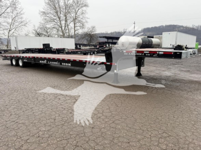 Landoll 930E drop deck trailer showing deck, wheels, and rear coupler with markings and stock decals.