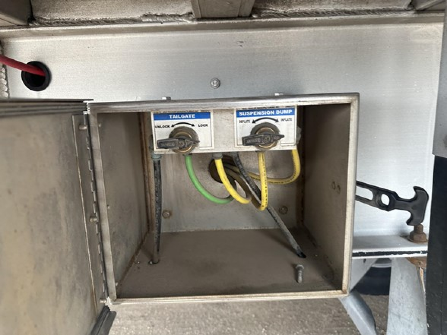 End dump trailer component with tailgate and suspension loom controls labeled tailgate and suspension dump