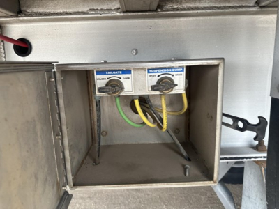 End dump trailer component with tailgate and suspension loom controls labeled tailgate and suspension dump