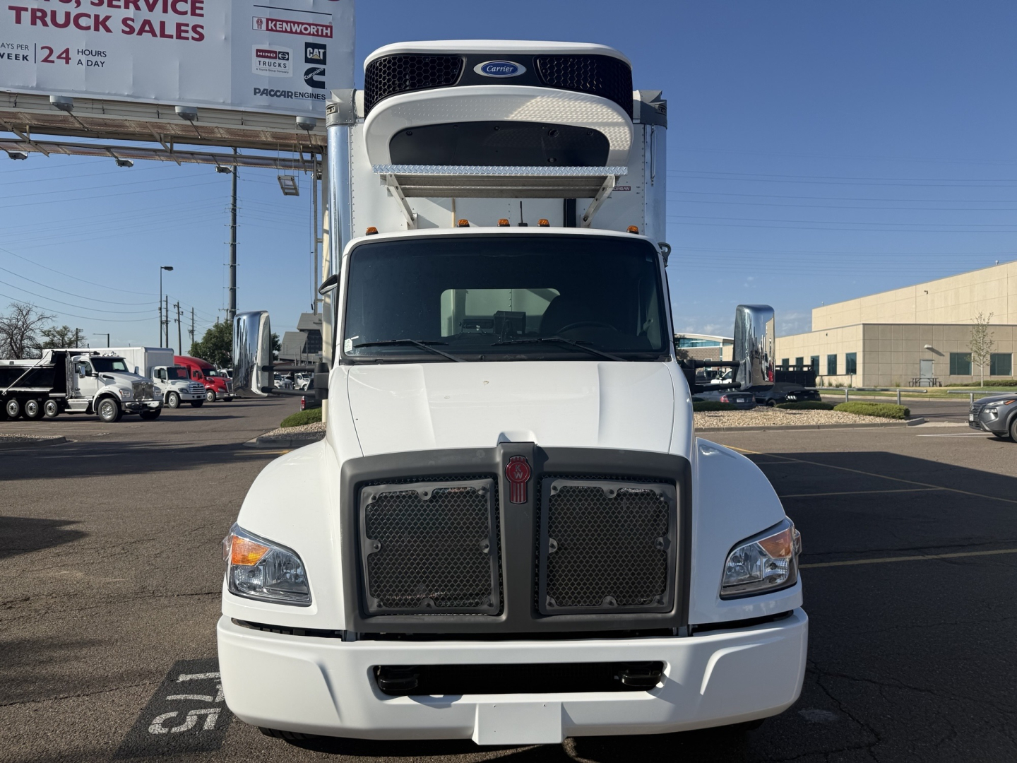 Kenworth T380 refrigerated truck front view showing dual grille, hood, and cab with front bumper.