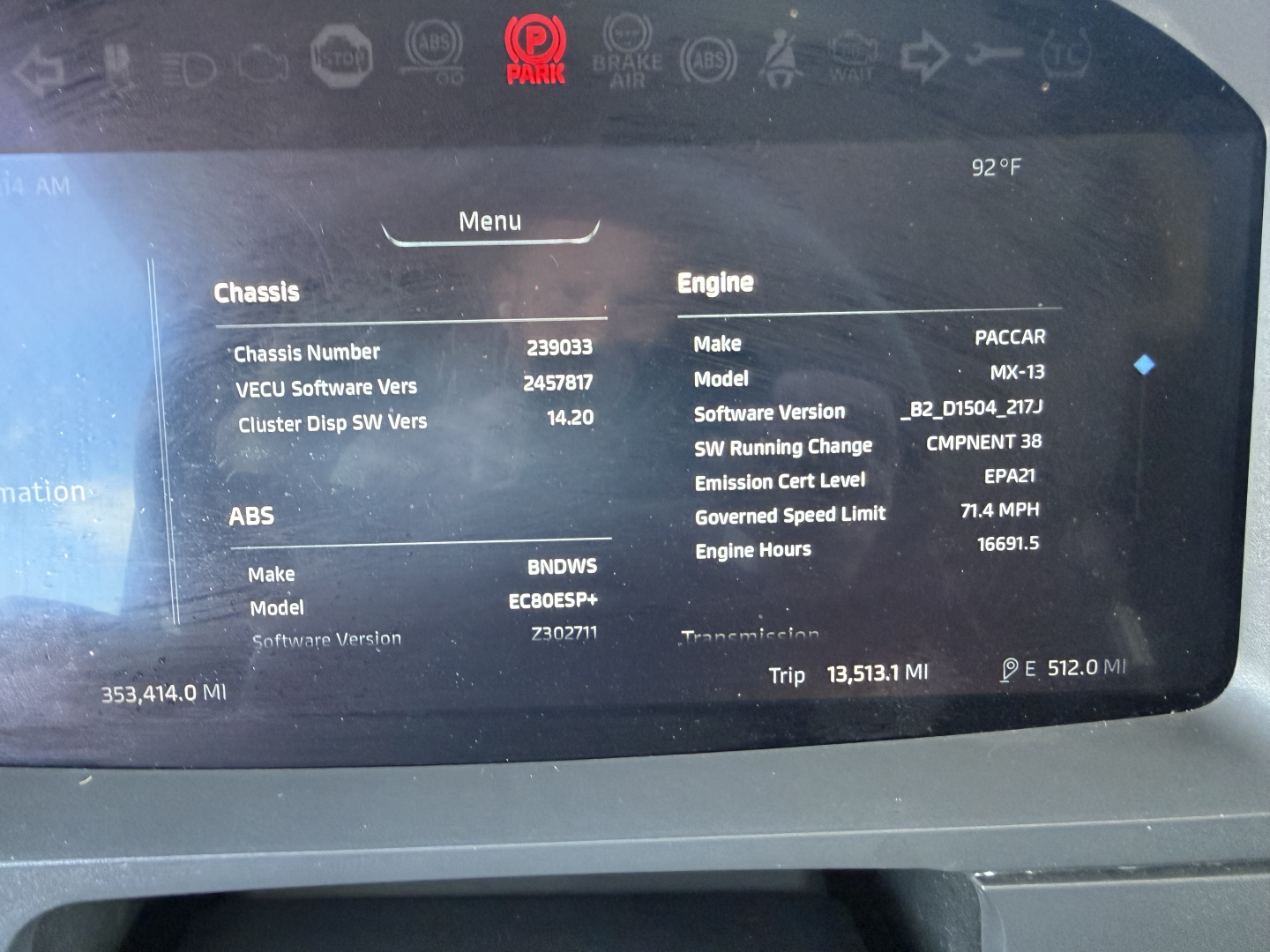 Dashboard screen showing engine, chassis, and software details for a Kenworth truck. Visible text includes Engine Make: PACCAR, Model MX-13, Software Version B2D_15.004_217J, SW Running Change CMPNEN 38, Emission Cert Level EPA-21, Gov Cert