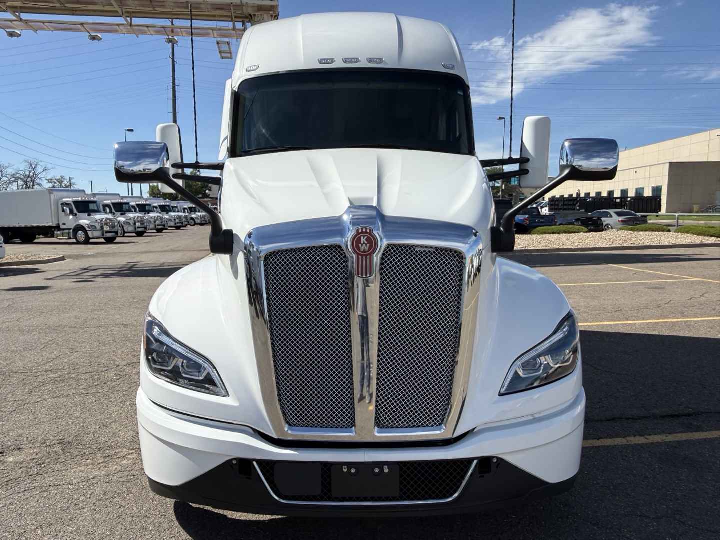 Kenworth T680 front view showing bold chrome grille and headlights.