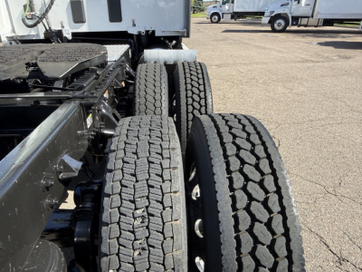 Kenworth truck chassis with dual rear axles and tires in view for 2023 Kenworth T680 listing.