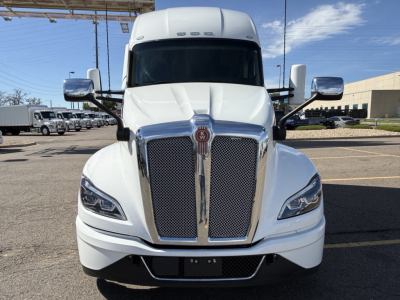 Kenworth T680 front view showing bold chrome grille and headlights.