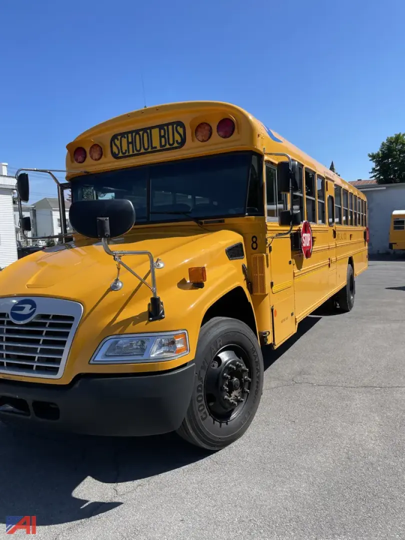 School bus showing front-left side of a yellow 2020 Blue Bird Vision bus with 'SCHOOL BUS' on the top front, black bumper, and round rearview mirrors.