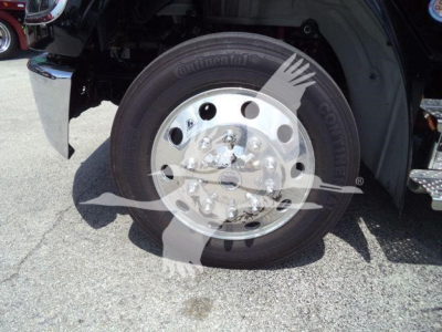Freightliner truck wheel with Continental tire and polished aluminum hub showing lug nuts and brake components.