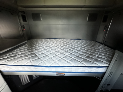 Kenworth T680 sleeper cab interior with large bed mattress visible