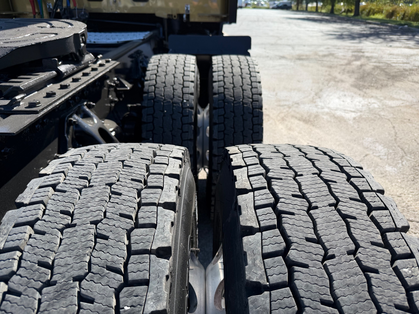 Kenworth T680 tractor rear wheels and duals with tread detail visible.