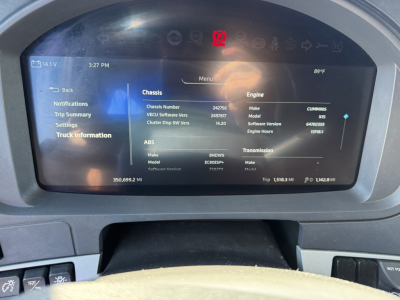 Kenworth T680 dashboard display showing vehicle information: chassis number 24275?; engine and transmission details; trip statistics at bottom left; various tabs including Menu, Chassis, Engine, ABS; digital gauges; shows 3:27 PM, 89°F.
