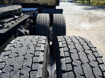 Kenworth T680 tractor rear wheels and duals with tread detail visible.
