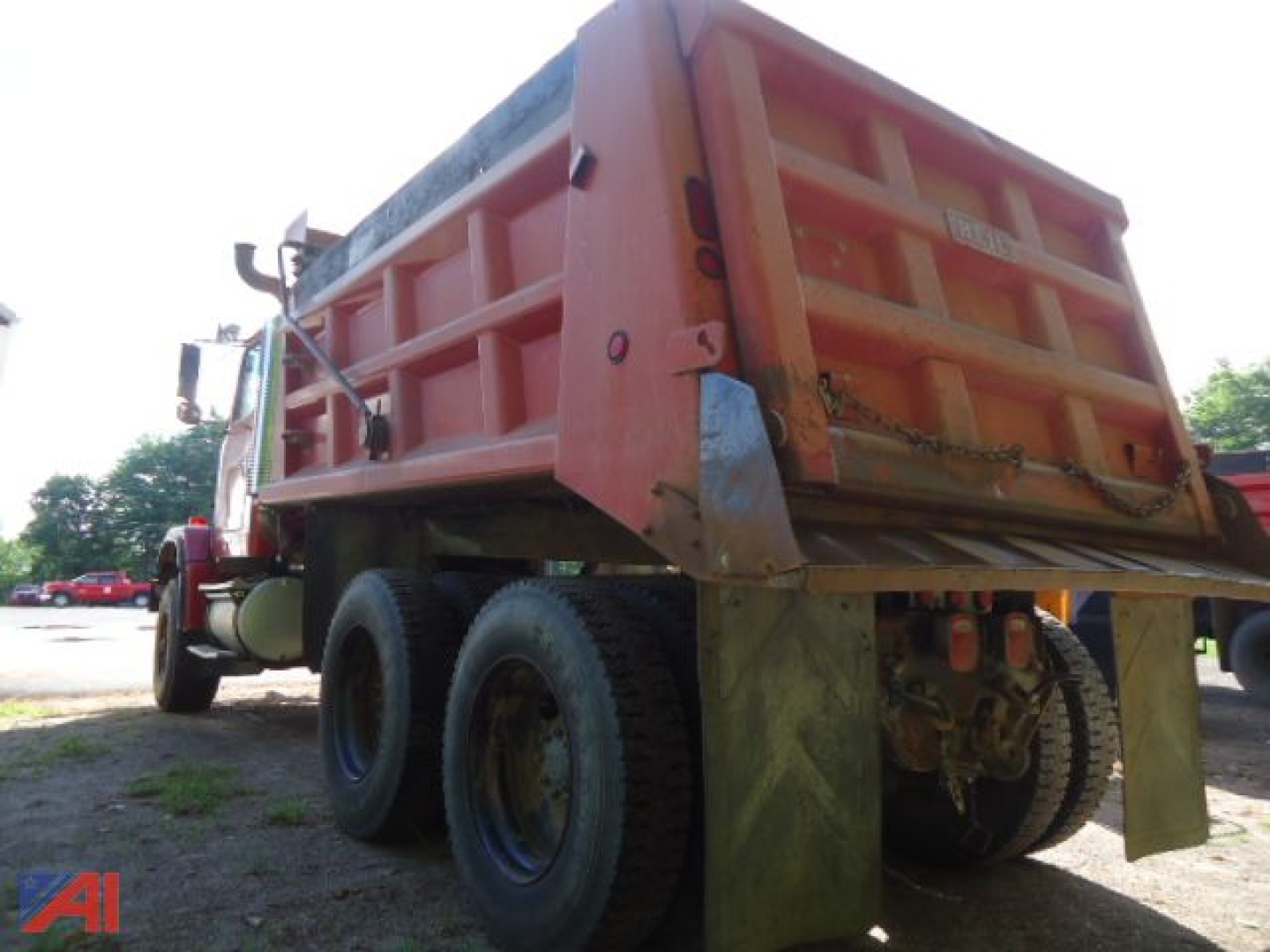 Volvo ACL dump truck rear view showing dump bed and dual rear axle configuration.