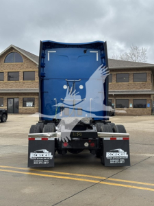 Peterbilt 579 truck rear shown, blue sleeper cab with mirror icon, stock number 2511150, 1XPBDP9X9PD854346 VIN, rear wheels, mudflaps, trailer chutes.