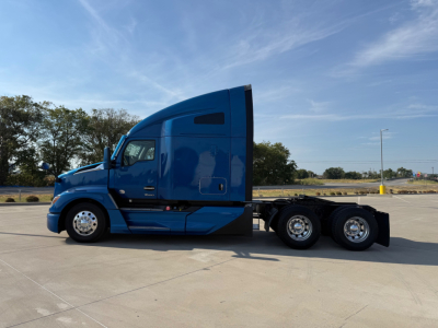Kenworth T680 tractor in blue cab side profile showing sleeper, 6x4 axle configuration, and chrome wheels.