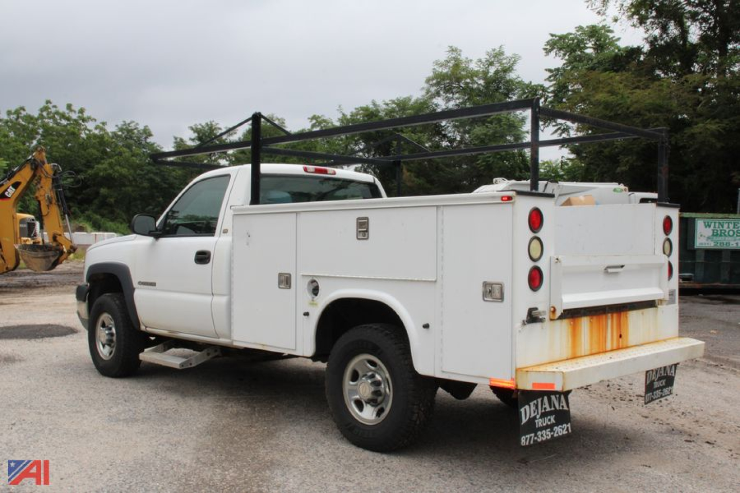 Utility service truck body on white 2004 Chevrolet Silverado 2500HD reg cab with utility compartments and rear work rack