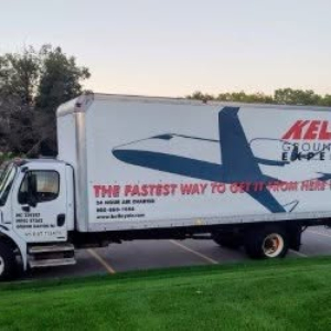 Truck side view showing Freightliner M2 106 box truck with graphics and logo on the cargo box.